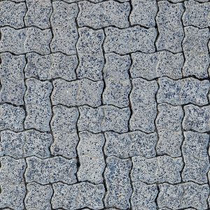 Top view of interlocking gray pavement pavers, showcasing a textured pattern.
